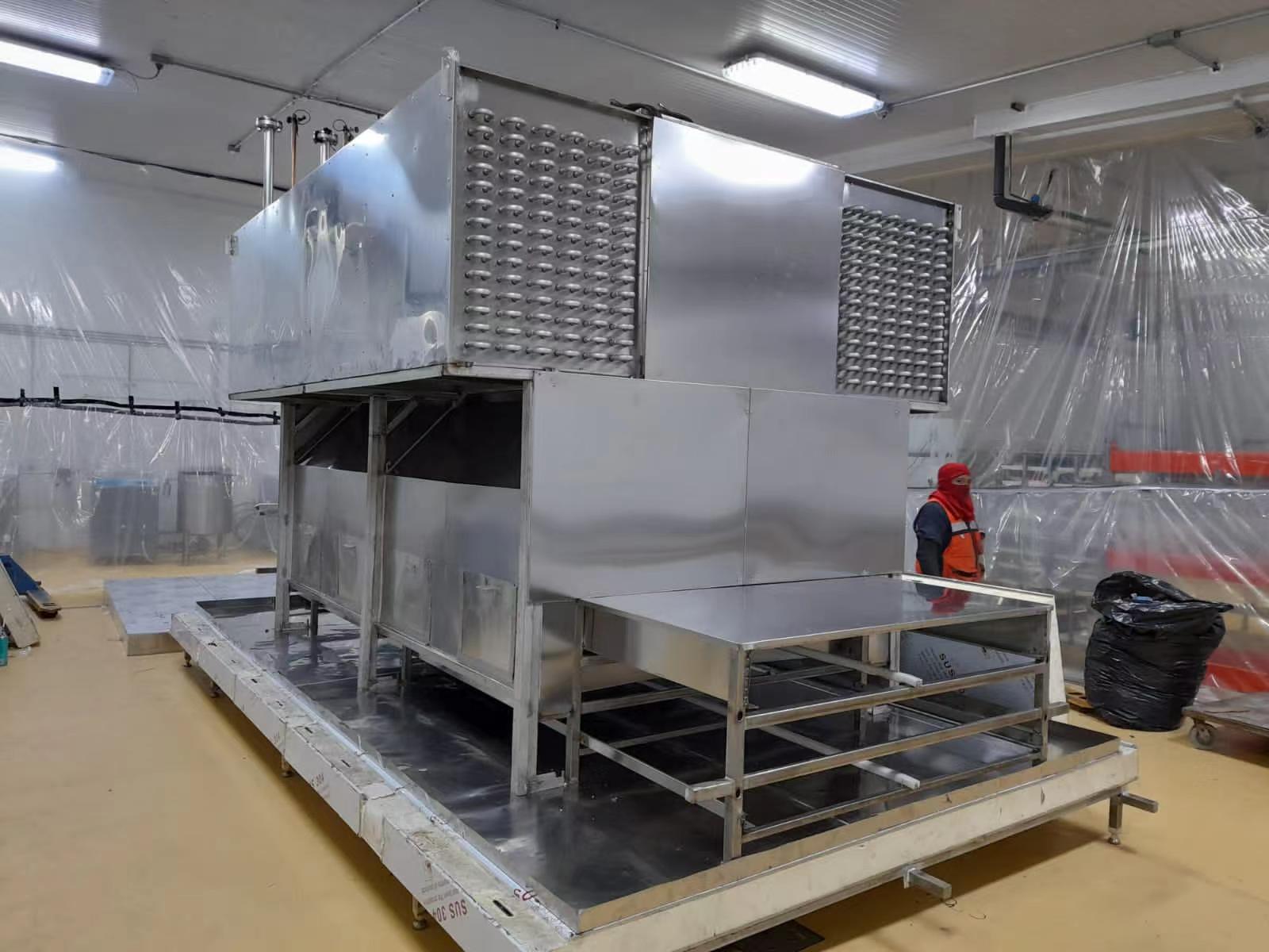 Internal view of the dual-chamber impact freezing tunnel showing food-grade mesh belt